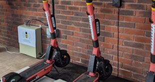 E scooters recharging on wireless charging pads Voi launches first wireless e-scooter charging trial in UK