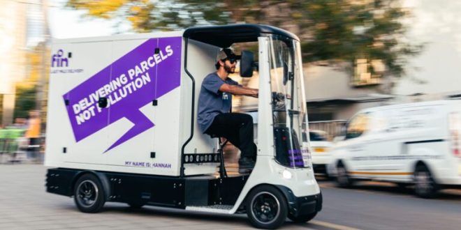 A Fin cargo vehicle being driven on the street