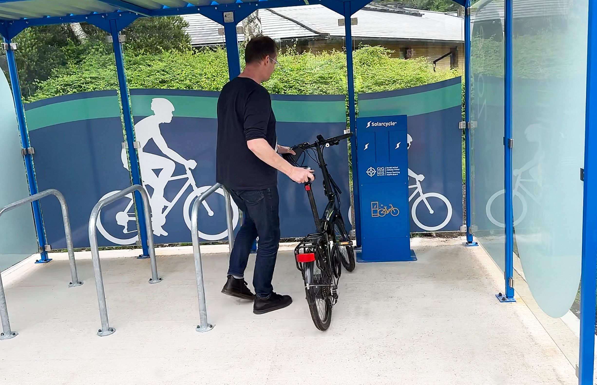 NHS Powys Teaching Health Board 3 Falco and Solarcycle debut bike shelters with 100% renewable e-bike charging