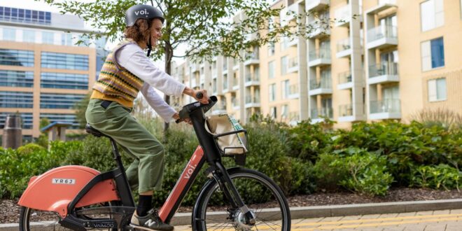 Riding an e bike in the city Voi encourages drivers to try an e-bike on Cycle to Work day with free rides 