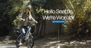 Wombi women on bike in park space Wombi expands e-bike subscription service